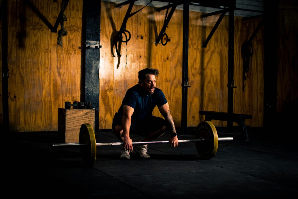 man lifting weights to boost testosterone naturally