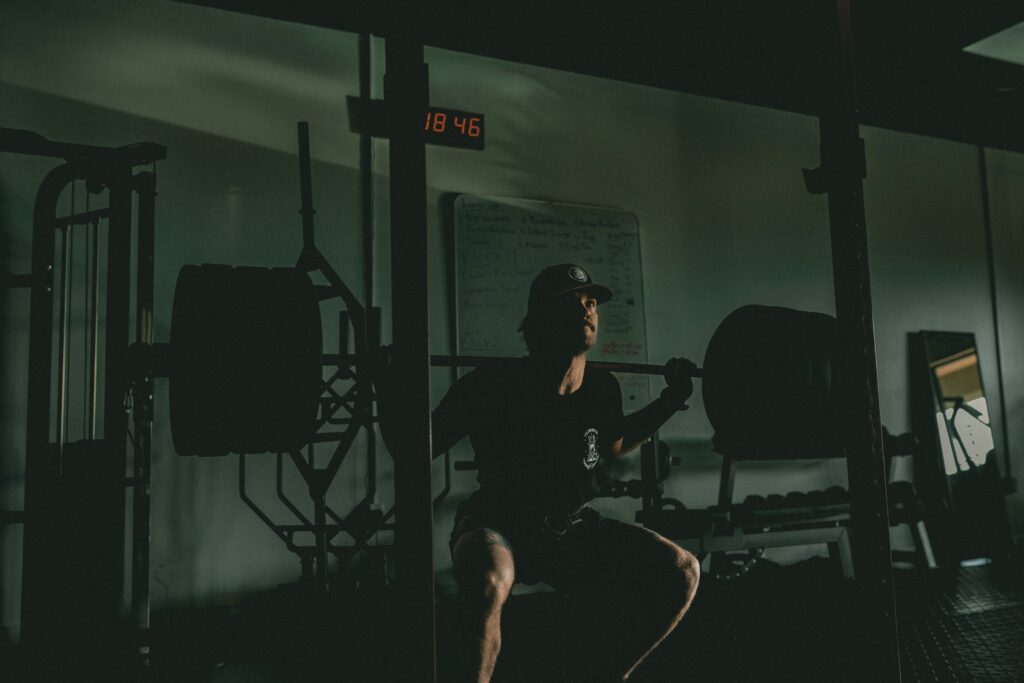 man training alone showing discipline and focus in dark gym