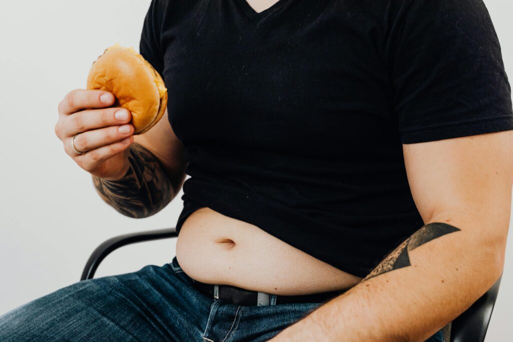 man checking belly fat weight loss fitness