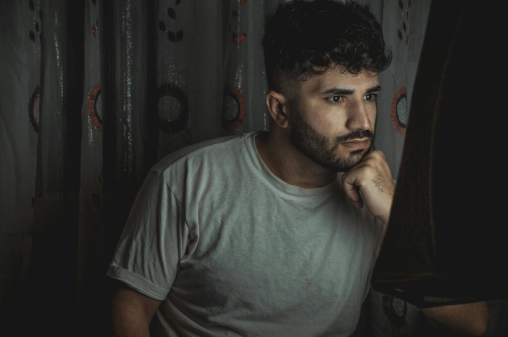 man reflecting on life feeling stuck and wasting time